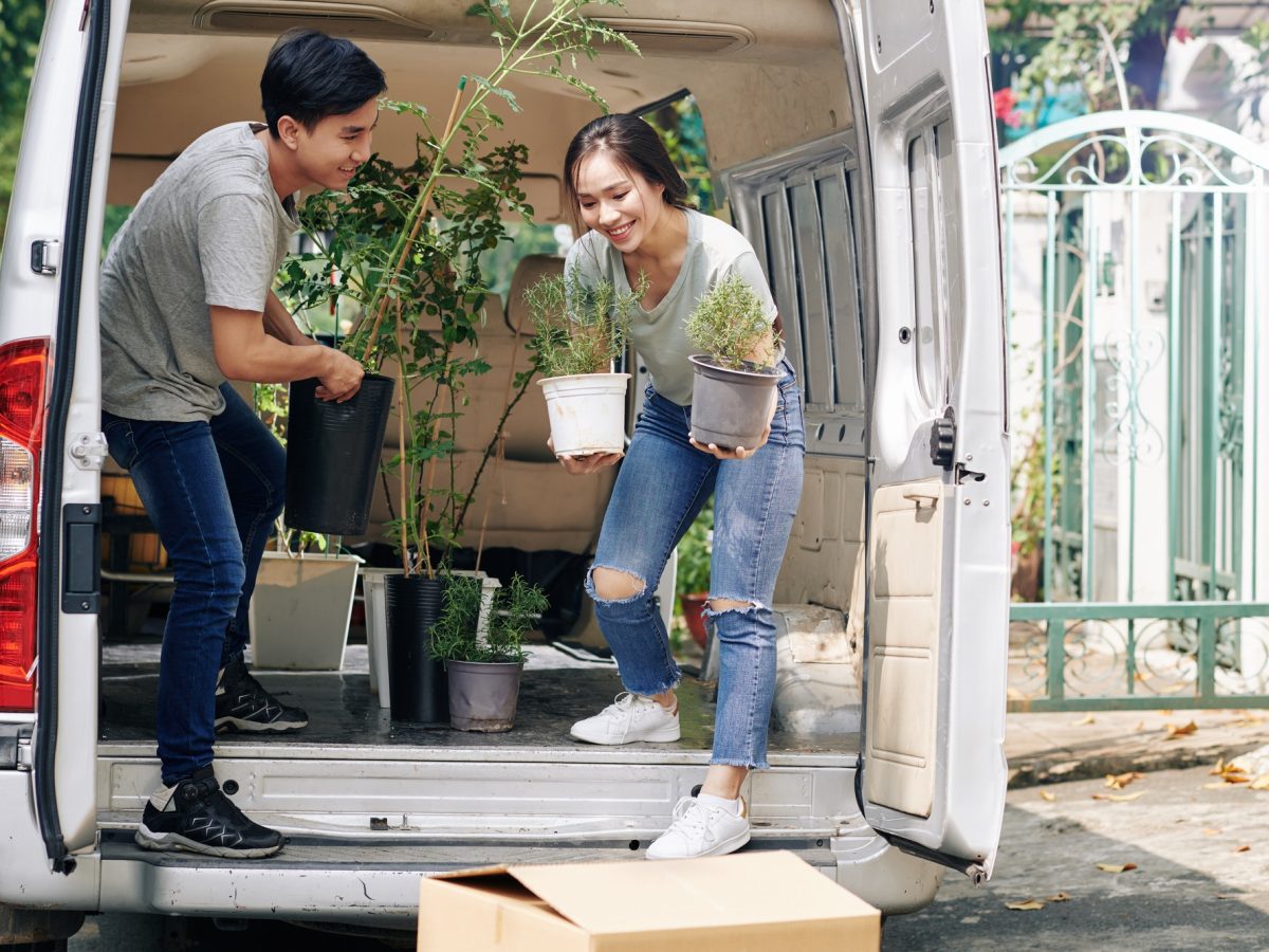 Couple unloading van