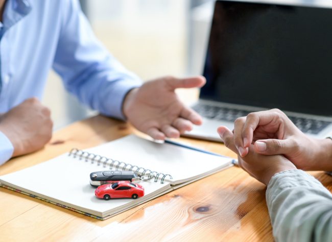 Finance staff are recommending car loans for customers.